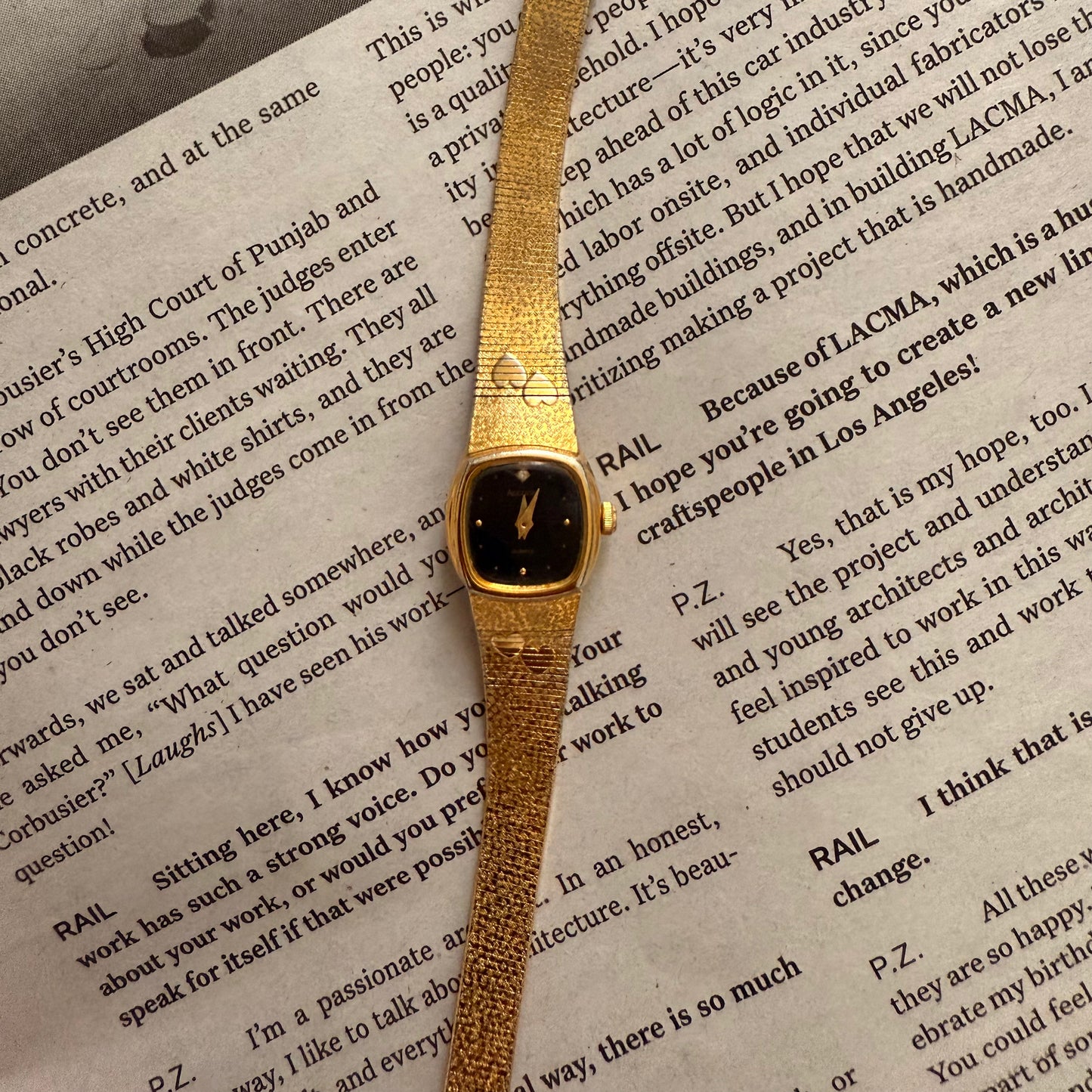 Gold black face hearts detail band watch