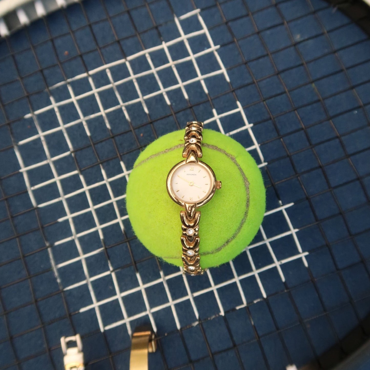 Gold slim circle embellished watch