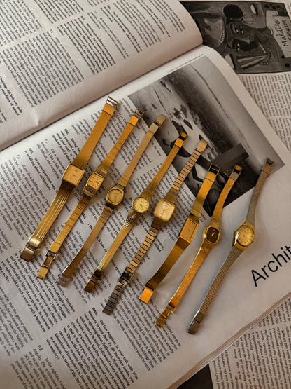 Gold black face hearts detail band watch