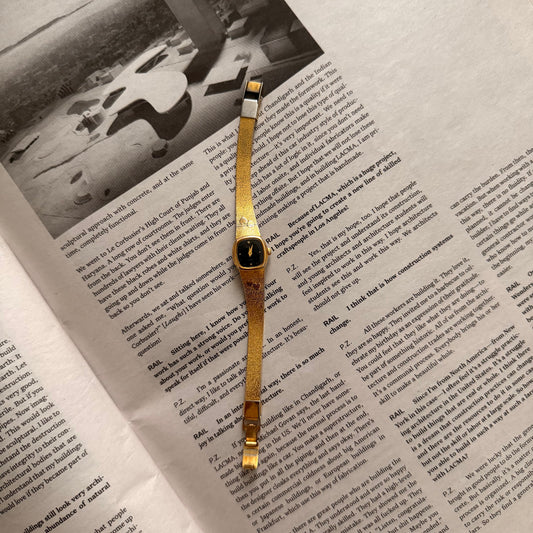 Gold black face hearts detail band watch